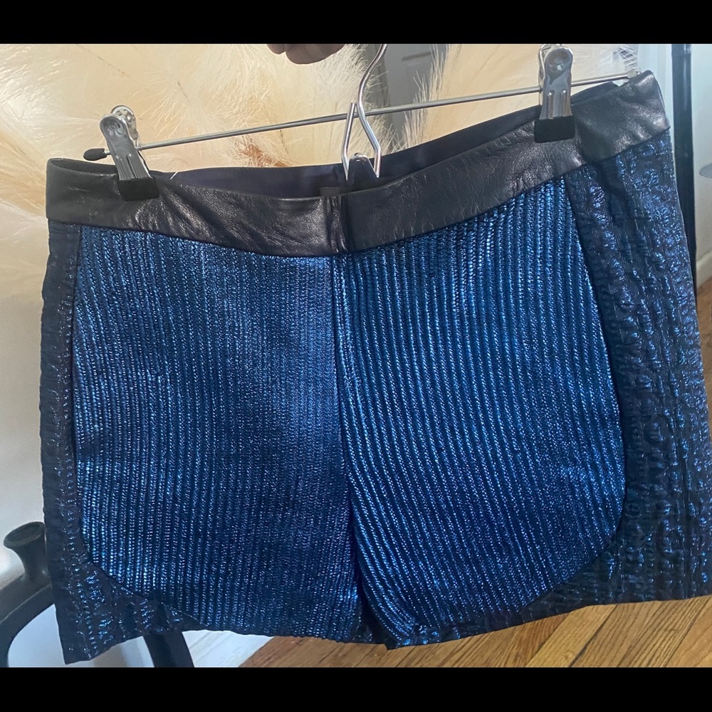 Monique Lhuillier  Sapphire leather trimmed short.  Size 8